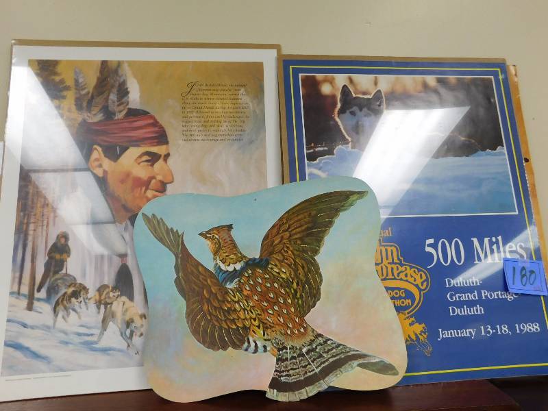 lot 180 image: John Beargrease Poster, Dog sled poster and pheasant wall hanging