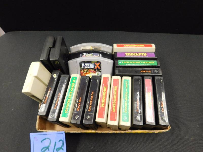 lot 212 image: 3 Nintendo 64 games and 18 Texas instruments cartridge games