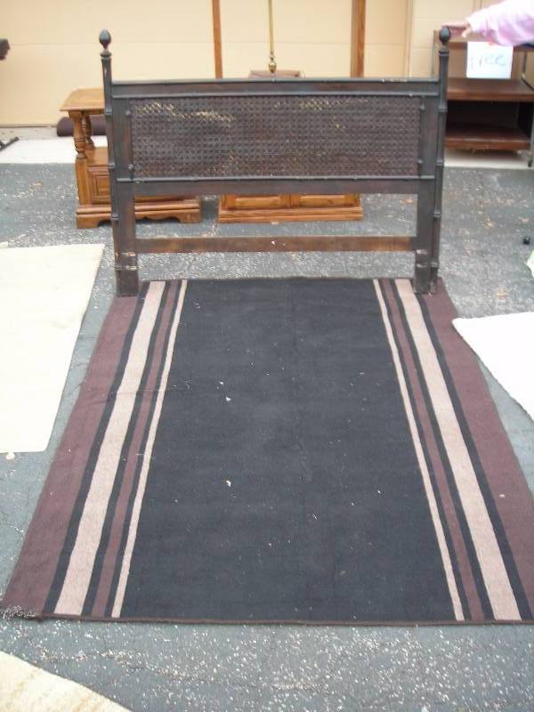 lot 43 image: Black & Brown Stripe Rug (83x60) And Dark WoodCane Head Board (57wx47t)