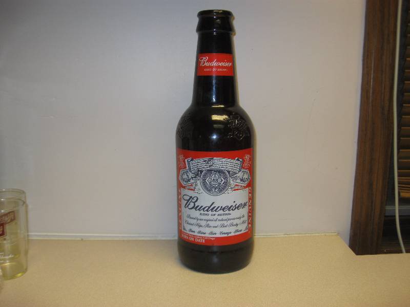 lot 91 image: Large Budweiser Glass Bottle....