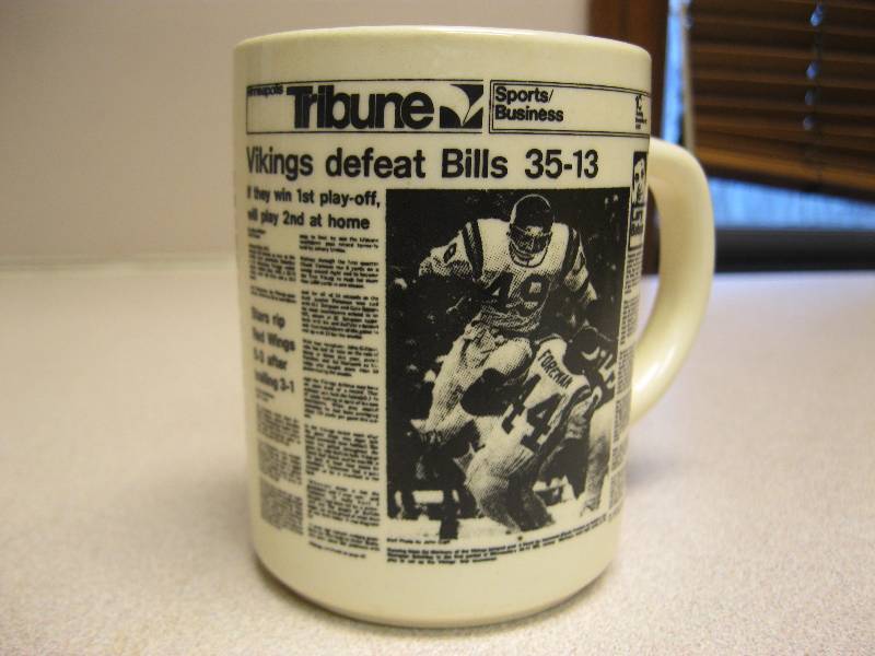 lot 127 image: Vintage Tribune Vikings Mug Dec 21 1975....