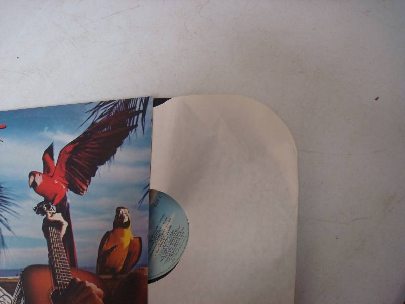 lot 297 image: Pair Of Jimmy Buffett Albums. Fair Condition....