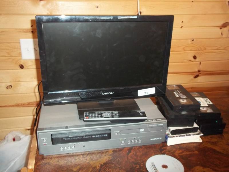 lot 72 image: Vhs  DVD player with small TV, and movies