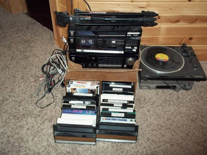 lot 81 image: Cassette player, Tuner, Record player, Vhs player, tripod, cords and VHS Tapes