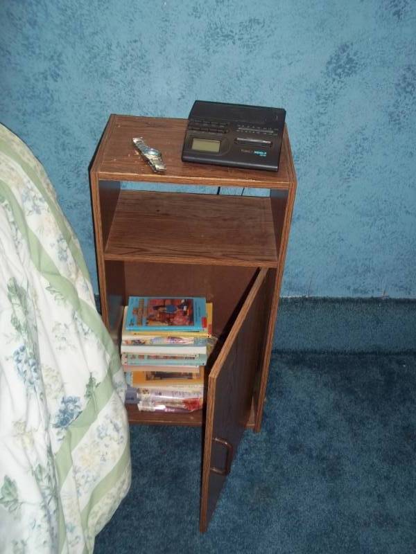 lot 114 image: Night stand with alarm clock, books and watch