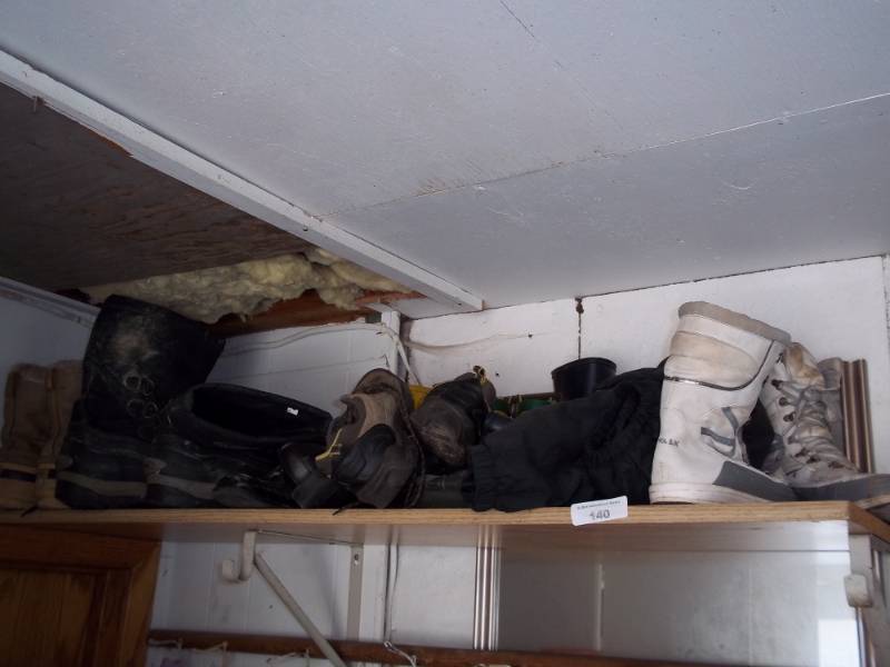 lot 140 image: Shelf full of boots