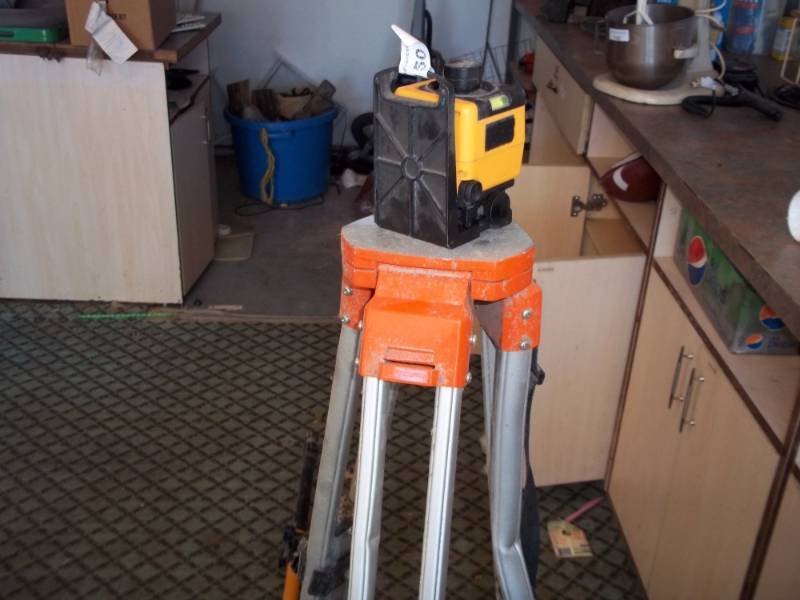 lot 150 image: Laser Transit with tripod and stick with receiver
