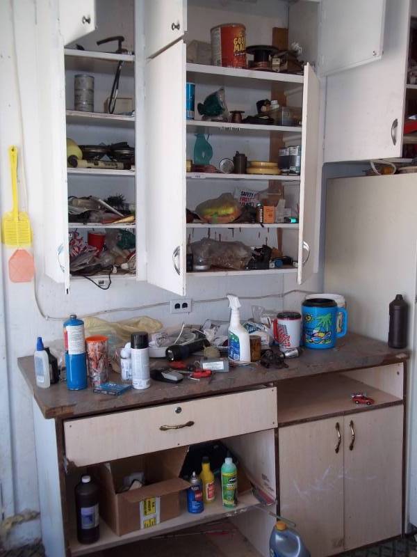 lot 163 image: Large lot included everything in upper and lower cabinets and on the bench