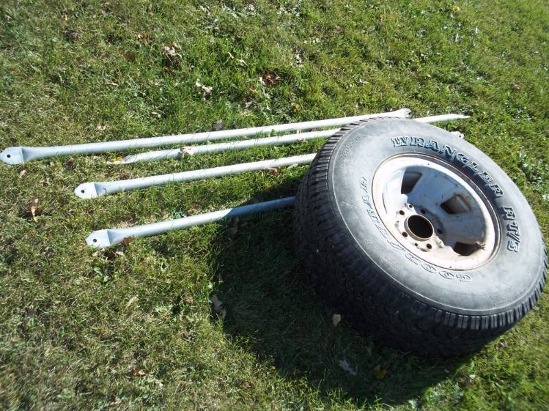 lot 177 image: Wheel and 4 brace bars