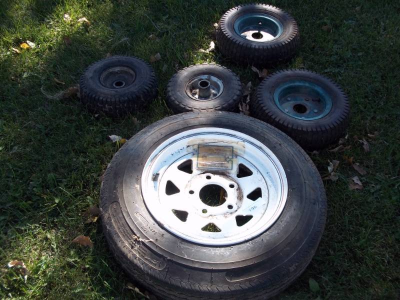 lot 196 image: 13 inch trailer tire with rim and mower tires