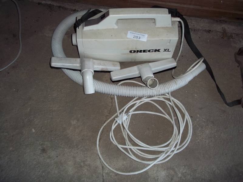lot 203 image: Oreck XL Vacuum with attachments