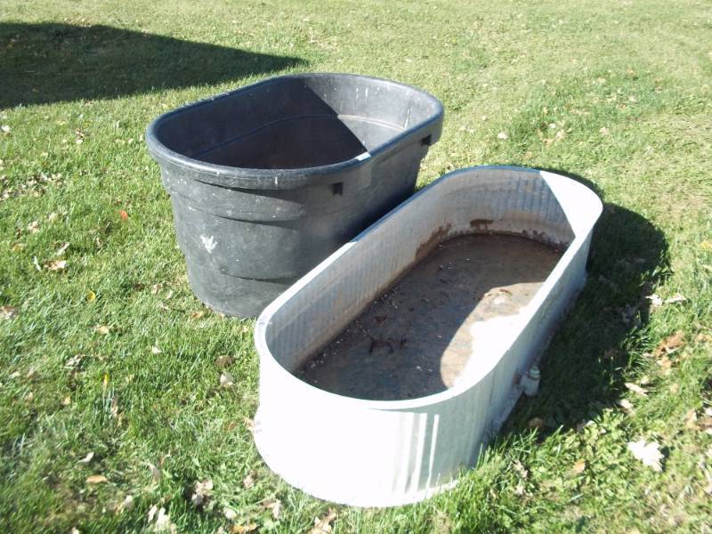 lot 333 image: Pair of cattle water tanks poly one has crack