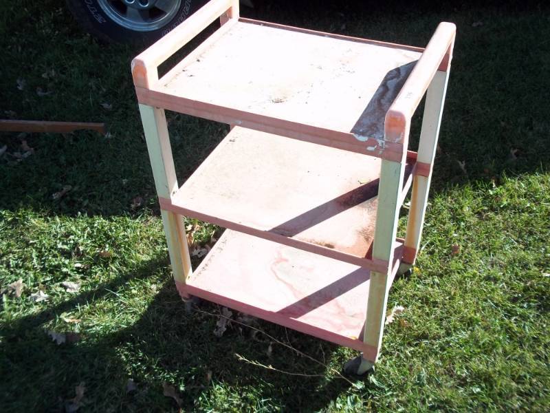 lot 339 image: Plastic green house table on wheels