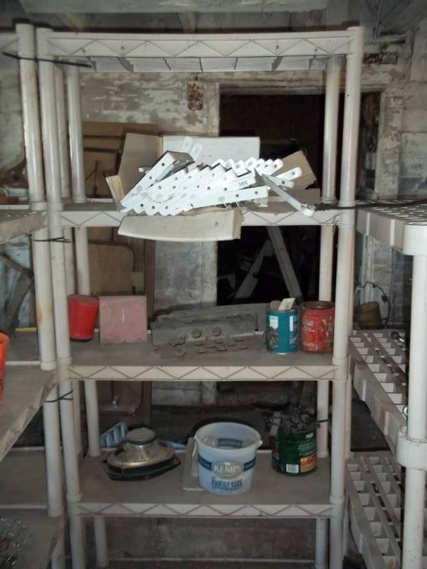 lot 355 image: Plastic shelf with contents and shelf brackets