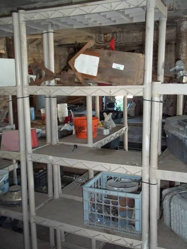 lot 358 image: Plastic shelf with contents and bird house
