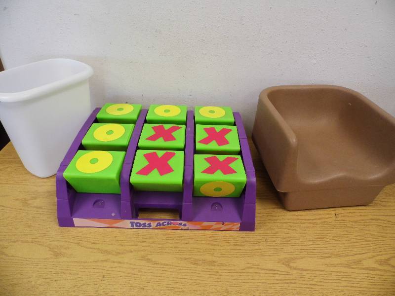 lot 14 image: Booster Seat, Garbage Can, Toss Across