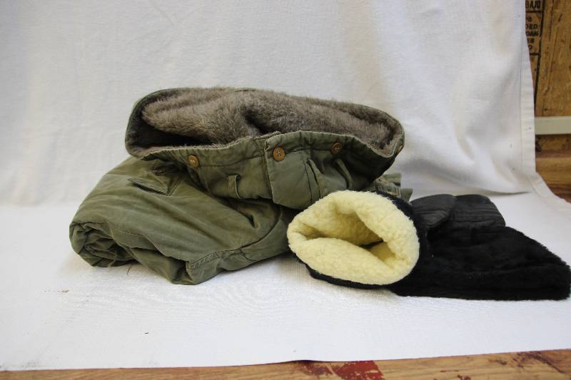 lot 15 image: Military surplus snow pants, leather mittens, and snow boots size 8