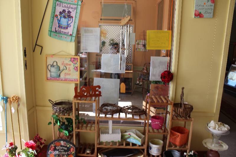 lot 10 image: Contents Of Bench & Wall Included Decorations Wooden Stands And More.