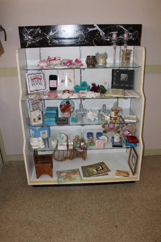 lot 39 image: Display Shelf Includes Contents 48 x 22 x 58.