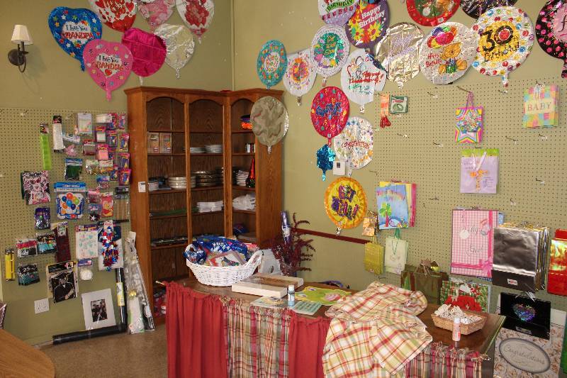 lot 53 image: Corner Lot Including Wooden Barrel Gift Balloons Paper Party Products And More.