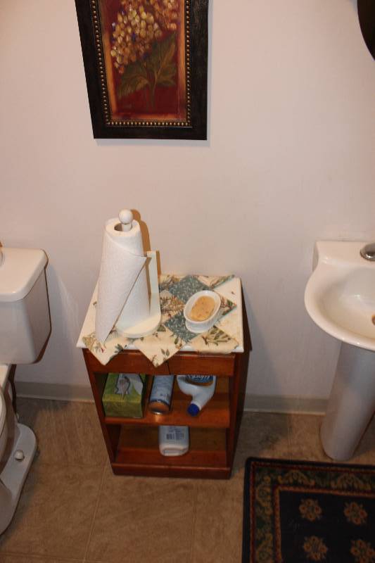 lot 69 image: Bathroom Lot Including Decorations Wooden Shelf And More.