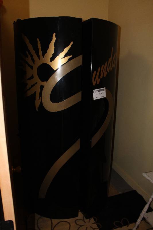 lot 2 image: Sundazzler Stand Up Tanning Booth 7214 Hours Indicated Tested and Operational.  Not sure of year.  Includes Contents Of Room.
