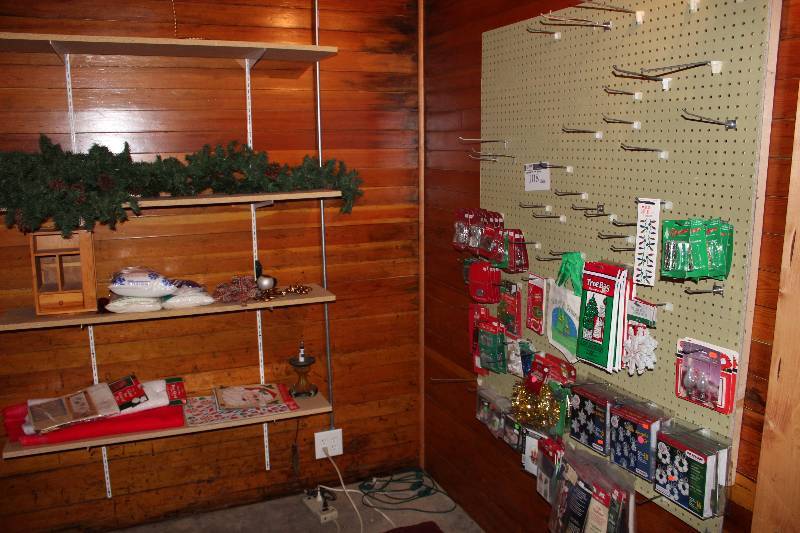 lot 108 image: Contents Of Room Including Holiday Decorations Shelving Unit And More.