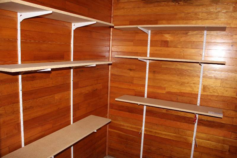 lot 109 image: Lot of Shelving Units Includes All Shelves In Room.