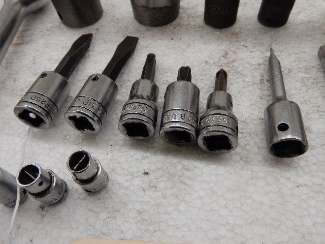 lot 121 image: SNAPON, 38 drive phillips and regular screwdrivers, SNAPON Slotted adjusting tools, 14in drive MAC 15mm, 13mm sockets 38 drive  MAC Flex impact 18mm SNAPON 78 Deep Well Socket 38 drive.. And other miscellaneous.