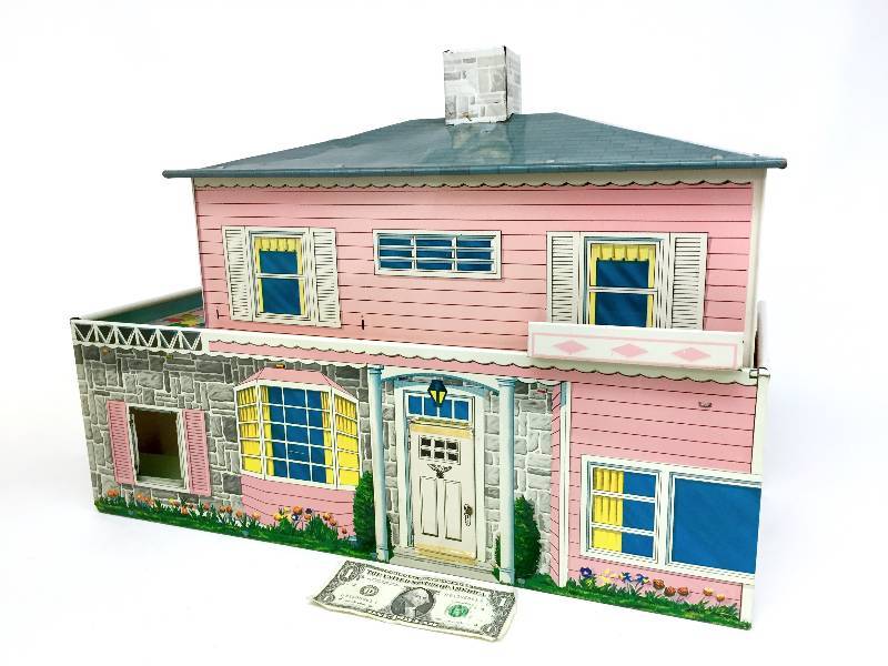 lot 8 image: Vintage tin pink lithographed dollhouse by Marx  complete with T.C. superior doll furniture