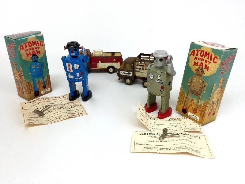 lot 17 image: Lots of 2 collectible  small Tonka Trucks and 2 collectible tin toy robots in original box
