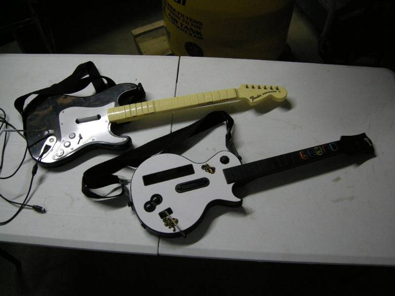 lot 8 image: Guitar Hero type guitars