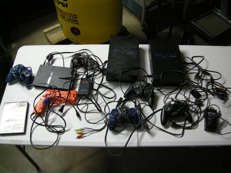 lot 12 image: PS2 Slim and 2 others
