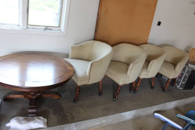 lot 19 image: Lot of (5) Including Oak Wooden Table Wooden Chairs wWheels & Cloth Upholstery Table 48 Diameter.
