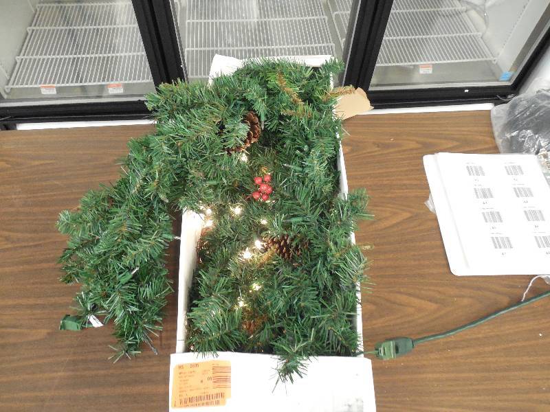 lot 42 image: 9 ft. Pre-Lit Hawkins Pine Artificial Garland with Clear Lights, Pinecones, Berries and