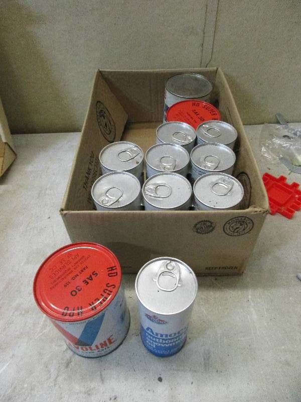 3 qts of motor oil, 9 cans of snowmobile oil