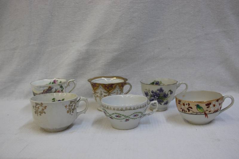 lot 22 image: Six china teacups. . . Future candle holders