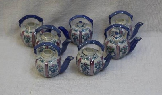 lot 28 image: 7 Miniature Teapots