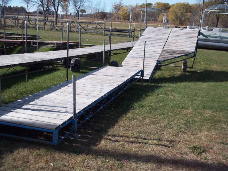 lot 3 image: 32 Steel dock with cedar decking 8 side platform with 45 degree corner, Shore end legs, poly wheels.