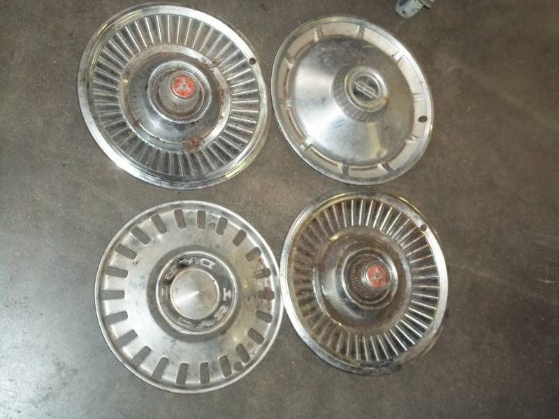 lot 101 image: 4 vintage hubcaps