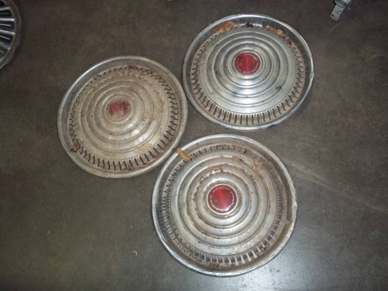 lot 102 image: 3 vintage hubcaps