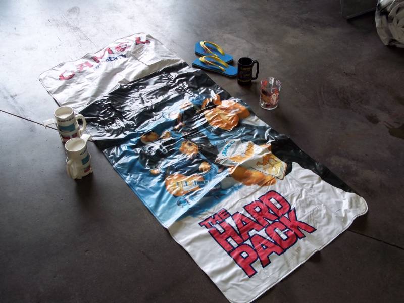 lot 80 image: Lot of Camel logo cups, Inflatable Mattress, tongs