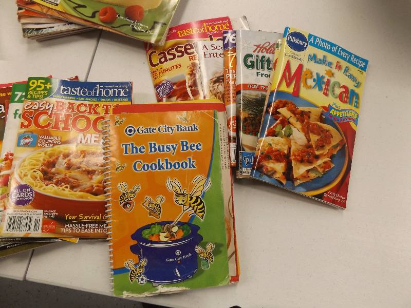 lot 31 image: Taste of Home Cookbooks and Vintage Magazine Rack
