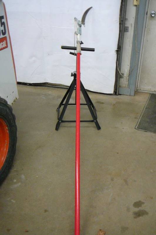 lot 90 image: Pole saw and adjust stand
