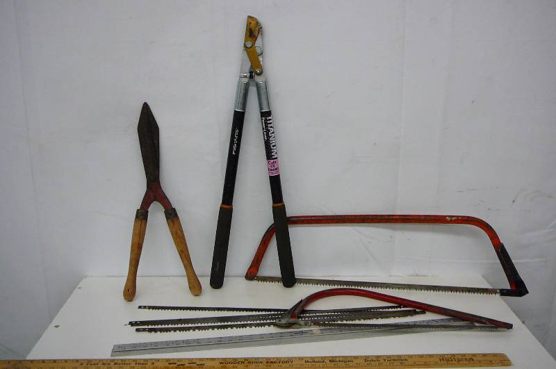 lot 22 image: Yard Tools 2 Bucksaws, Blades, Hedge trimmer, Pruner 30 Yardsticks