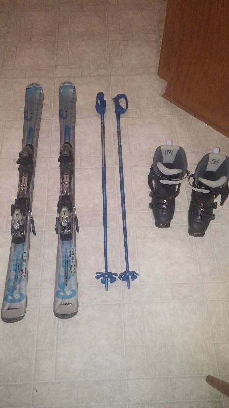 Atomic down hill skis with poles and Salomon boots